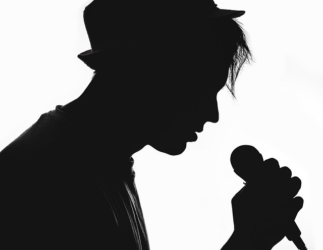 Person singing in silhouette
